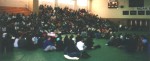 The audience continues to watch the awards assembly.
